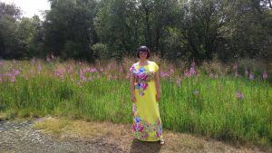 Clare Bennett in field with flowers